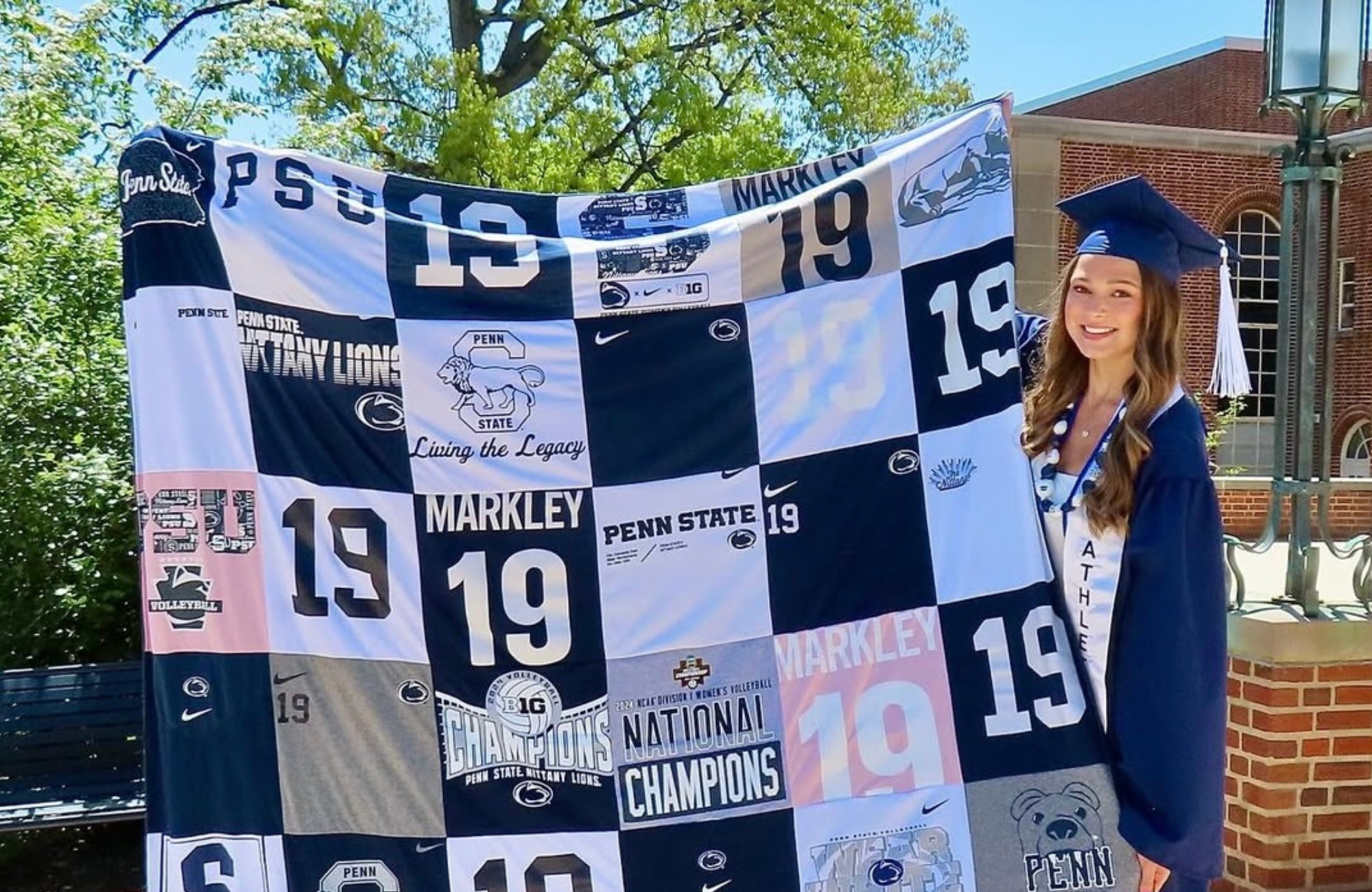 Custom Project Repat t-shirt memory quilt displayed on a couch — made from college and high school t-shirts